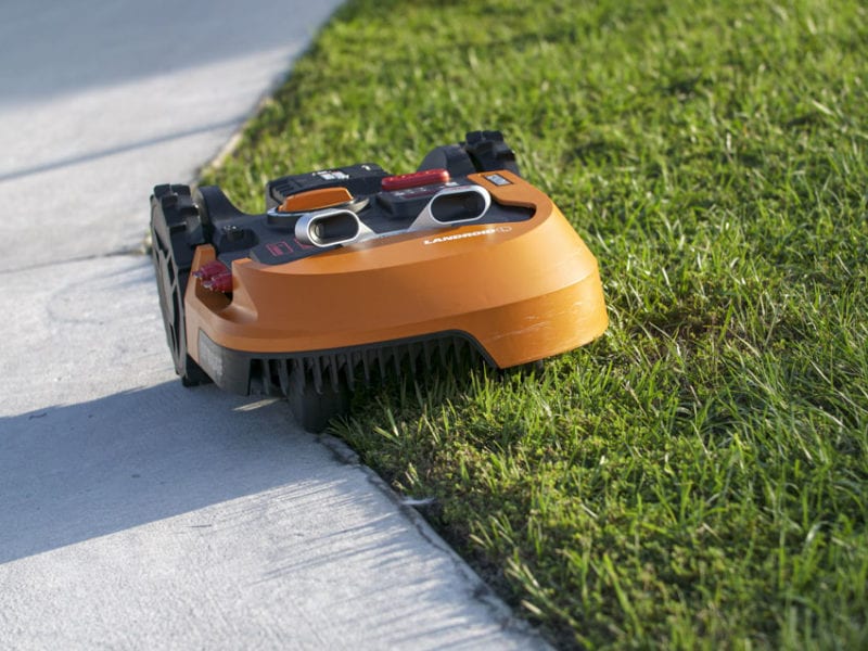 Robot Lawn Mowers Review 2026: Are Autonomous Mowers Worth the Investment? worx landroid l wr155e autonomous mower on suburban lawn